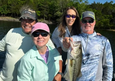 Family group enjoying a guided bass fishing experience
