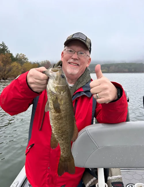 Angler holding a bass on a lake in Florida